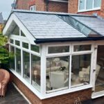 Elegant solid tiled conservatory roof with modern insulation, enhancing comfort and energy efficiency.