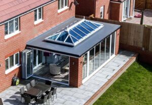 Bright and modern glass extension creating a light-filled living space for a South Wales home.