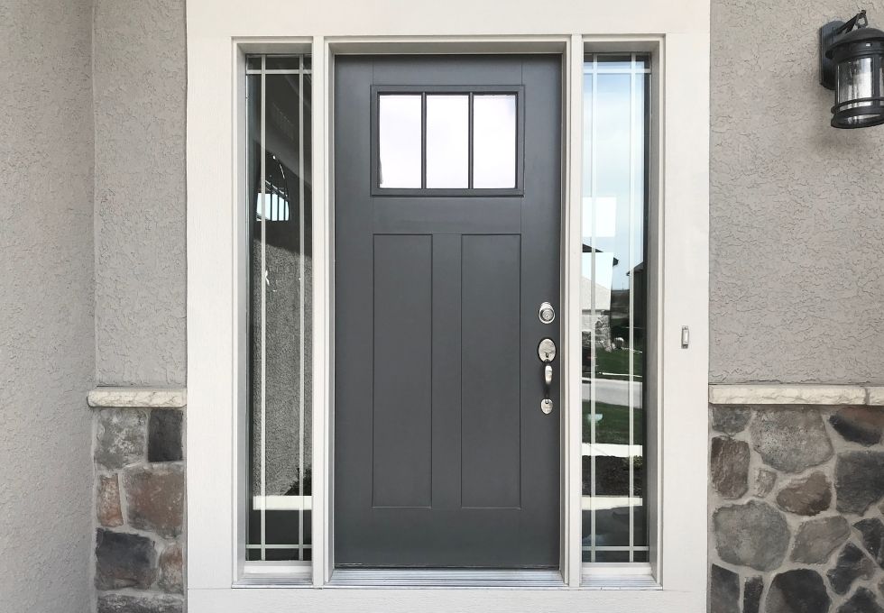 Modern anthracite grey composite door installed in Newport stylish range.